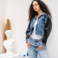 Blue leather sleeves jacket by Aya Osama Couture paired with denim jeans, perfect for stylish and trendy outfits in Egypt.