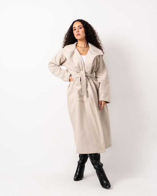 Elegant beige oversized wool blend coat by Aya Osama Couture, perfect for winter; stylish, warm, and luxurious women's fashion coat.