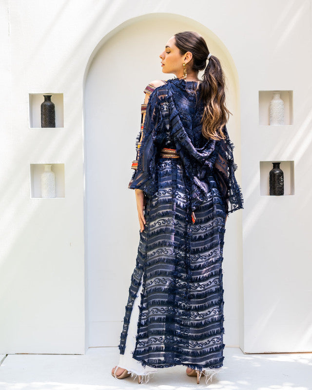 Elegant blue Moroccan kaftan with fuzzy tulle, semi-sheer textured fabric, and intricate Indian embroidery by Aya Osama Couture.