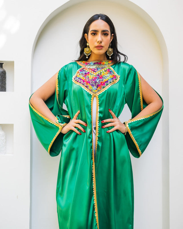 Elegant green Moroccan abaya in pure satin by Aya Osama Couture, showcasing traditional modest fashion and Islamic clothing for women.