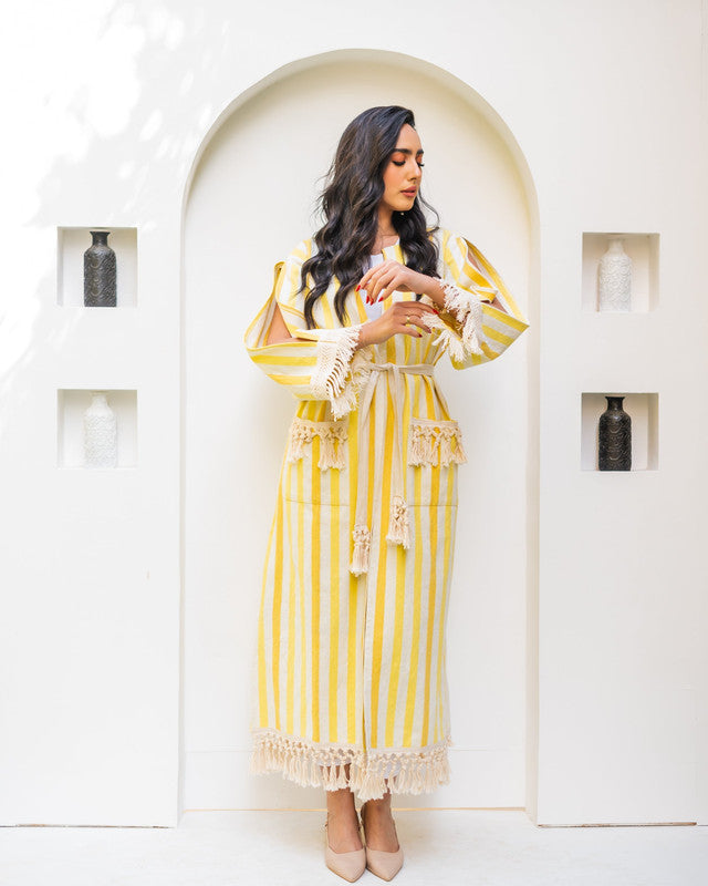 Elegant yellow-striped kaftan dress by Aya Osama Couture, perfect for summer; a modern blend of traditional Egyptian abaya and contemporary fashion.