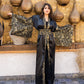 Elegant black satin kaftan with brocade detailing by Aya Osama Couture, perfect for special occasions and evening wear.