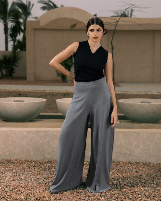 Elegant grey flowy pants by Aya Osama Couture, made in Egypt, featuring lightweight CY fabric for a comfortable, stylish, and breathable summer look.