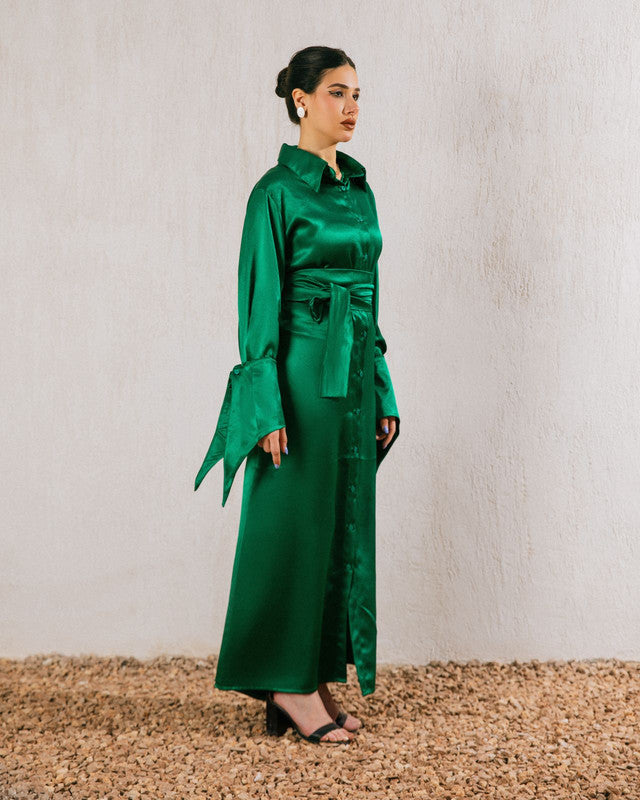 Green satin modest shimmer dress with sleeves by Aya Osama Couture, perfect for evening parties and formal events.