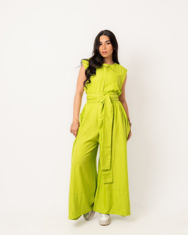 Lime green linen overall by Aya Osama Couture, made from breathable Egyptian linen, perfect for summer casual wear and sustainable fashion.